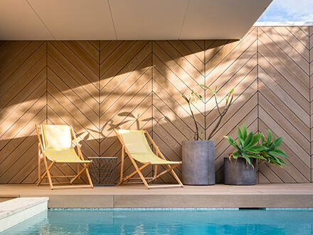 Golden Oak decking around pool with screening